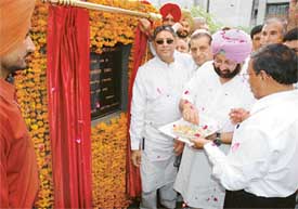 Punjab Chief Minister Capt Amarinder Singh shares sweets with members of the District Bar Association after laying the foundation stone for the lawyers chambers in new district courts 