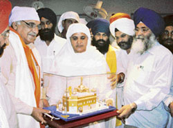 Haryana Chief Minister Bhupinder Singh Hooda being honoured with a replica of the Harmandar Sahib during his visit to Amritsar on Friday. 