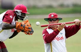 West Indies wicketkeeper Courtney Browne and assistant coach David Moore during a practice session