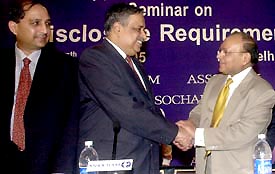 SEBI Chairman M. Damodaran shakes hand with Mahendra K. Sanghi, President, Assocham, during a seminar in New Delhi on Saturday