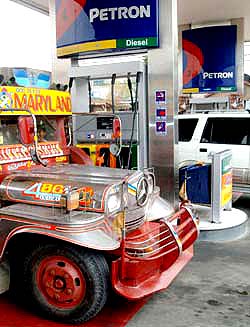 A vehicle waits to be filled with diesel at a petrol station in Manila on Saturday. Khalid Al-Faddagh, president of the Philippines oil refiner Petron Corp