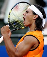Spains Rafael Nadal celebrates after winning a point against Czech Republics Radek Stepanek during their quarterfinal match at the Rome Masters