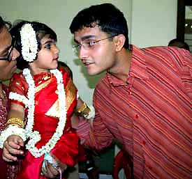 Indian cricket captain Sourav Ganguly greets his daughter Sana after her first on stage performance on the occasion of Rabindranath Tagore's birth anniversary