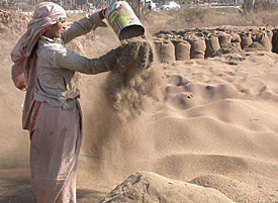 Maal Devi is as good at the job as the men when it comes to seeing if the can may hold more than mere dust.