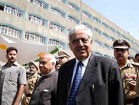 The J and K Chief Minister arrives with officials in Srinagars Civil Secretariat, which reopened on Monday after the Durbar move