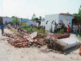 An MC demolition team razed a few houses built on the municipal land in the Mandeep Nagar locality near Rishi Valmiki Nagar, Ludhiana, on Monday