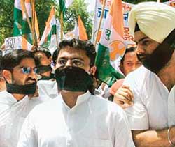 Activists of the Indian Youth Congress led by its president Ashok Tanwar during a silent march against the continued boycott of Parliament by the NDA at Parliament Street in New Delhi on Monday. 
