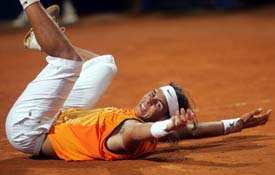 Spains Rafael Nadal celebrates after defeating Argentinas Guillermo Coria in the final of the Rome Masters tennis tournament at Romes Foro Italico on Sunday
