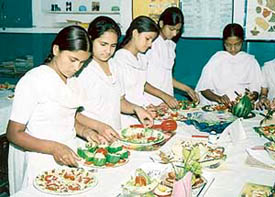 Students of Government Girls Model Senior Secondary School, Sector 8, prepare salads at the salad-making contest on Tuesday. 