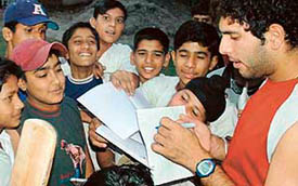 Indian cricket player Yuvraj Singh giving autographs to budding players at DAV School, Sector 8, Chandigarh on Tuesday. 