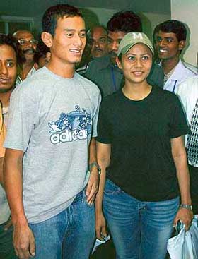 Baichung Bhutia comes out of a hospital in Kolkata with his wife Madhuri after being discharged on Wednesday