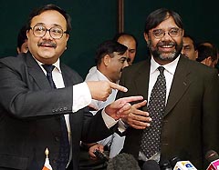 Additional Secretary of Pakistans Ministry of Communication Mohammad Abbas jokes with Alok Rawat, Indias Joint Secretary, Department of Road Transport and Highway, after the end of their talks in Islamabad on Wednesday