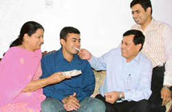 Madhur Verma (centre) celebrates with family after making it to the civil services. 
