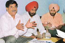 Mr V.K. Tiwari, Mr S.S. Hundal and Mr Aminderpal Singh, all members of the All Federation and College Teachers Association, address mediapersons in Ludhiana