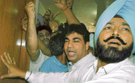 Office-bearers of the Chandigarh Territorial Congress Committee raise slogans to show differences to party observer from Delhi in Chandigarh on Friday. 