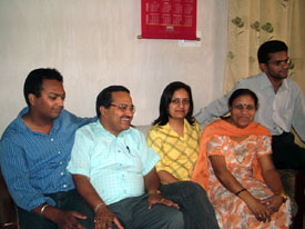 Ritu Sharma with her parents and two brothers at her residence in Hisar on Friday