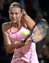 Maria Sharapova of Russia returns the ball to Mary Pierce of France during their match at the Rome Masters