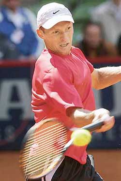 Nikolay Davydenko of Russia returns the ball to Filippo Volandri of Italy during their quarterfinal match at the Hamburg Masters on Friday
