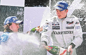 Kimi Raikkonen (R) of Finland ended Spaniard Fernando Alonsos winning streak with his triumph in the Barcelona Grand Prix