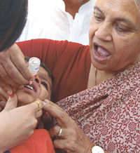  Chief Minister Sheila Dikshit administering polio drops to a child, during a polio eradication drive in the Capital