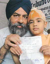 Jaspreet with his grandfather and court summons in Ludhiana