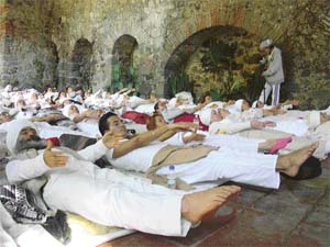 A yoga class in progress under the guidance of Jai Hari Singh
