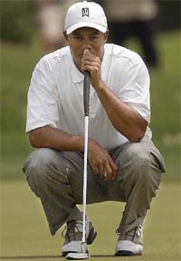 Tiger Woods awaits his turn to putt on the sixth hole during the second round of the Byron Nelson Classic at Irving in Texas