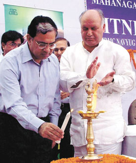 Justice A. K. Sikri along with Justice B. A. Khan lighting a lamp to mark the inauguration of MTNL Lok Adalat, jointly organised by Delhi Legal Service Authority and MTNL in the Capital on Sunday