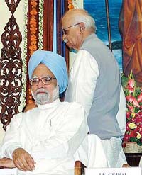 Prime Minister Manmohan Singh and former Deputy Prime Minister L.K. Advani during a special memorial meeting