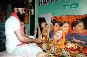 Pappu Sardar, a die-hard fan of Bollywood actress Madhuri Dixit, performs pooja