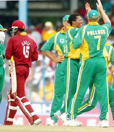 South African players celebrate the dismissal of West Indies batsman Chris Gayle during the fourth one-day international at the Queen's Park Oval in Port-of-Spain on Saturday.