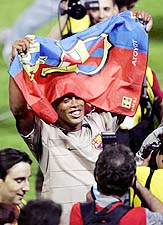 Barcelonas Brazilian striker Ronaldinho celebrates after the football club won the Spanish league title in the Ciudad de Valencia stadium in Valencia, Spain, on Saturday. Barcelona won their first league title in six years by drawing 1-1 with Levante.