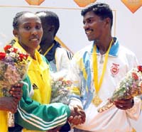India's K.C.Ramu, winner in men's category, congratulates women's champion Kone Alemu