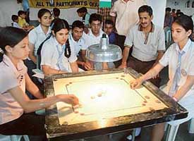 Junior semifinals carrom match in progress