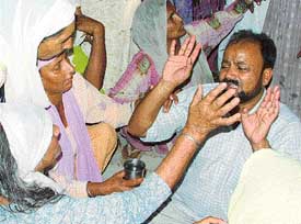 Accused Narinder Singh wails at his residence in Ludhiana on Monday