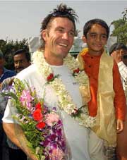 Former Wimbledon champion Pat Cash with a child on the premises of the Bengal Tennis Association in Kolkata on Monday.