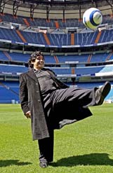 Argentine soccer legend Diego Maradona kicks the ball during a visit to Real Madrids Santiago Bernabue stadium
