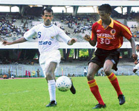 East Bengals Climax Lawrence (right) and Dempos Mario Soares fight for the ball during a National Football League match at Salt Lake Stadium in Kolkata on Monday. 