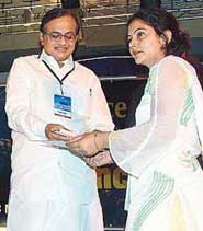Poonam Sinsinbar from Haryana receiving the Women Exemplar, 2005, award from Finance Minister P. Chidambaram during a CII conference in New Delhi on Tuesday.