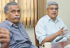 CPM leader Prakash Karat (right) and Debabrata Biswas of the All-India Forward Bloc at a meeting of Left parties in New Delhi on Tuesday.