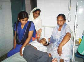 Seema, who was injured in a wall collapse, with her elder sister and two other relatives at Civil Hospital, Khanna