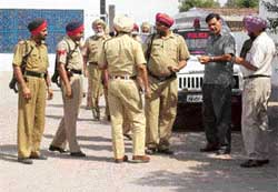 A police party at the scene of the crime in Kanganwal village near Ludhiana on Wednesday