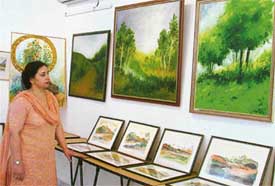 Karuna Mohindre, Director of TAC Art Gallery, with her paintings which will be displayed in East African nations