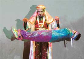 Magician O.P. Sharma suspends one girl in mid air during one of his popular tricks at a magic show in Ludhiana on Wednesday