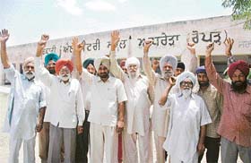 Villagers protest in front of the Government Elementary School, Adhrera village (Kurali) against the poor result of the school in the middle standard examination