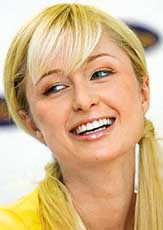 Paris Hilton, a US socialite and star of TV reality show  A simple life smiles during a news conference as part of a promotional appearance for German Internet company, GoYellow, in Munich on Friday.
