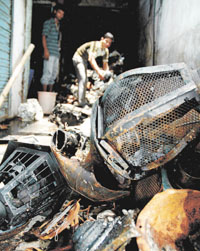 The gutted remains in a shop at Bhagirath Place.