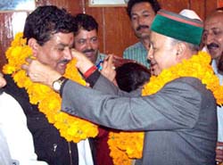 Himachal Pradesh Chief Minister Mr Virbhdra Singh (right) greets to Mr Vidya Sagar (left), newly elected Shimla (rural) Congress Committee President at State Congress Office at Shimla on Friday