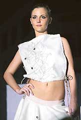 A model presents a creation by NIFT students at a fashion show in Gandhinagar (Gujarat) on Friday night .