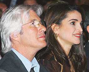 Queen Rania of Jordan sits next to Hollywood actor Richard Gere at the World Economic Forum meeting in the Jordanian Dead Sea resort of Shuneh, south of Amman on Saturday.
